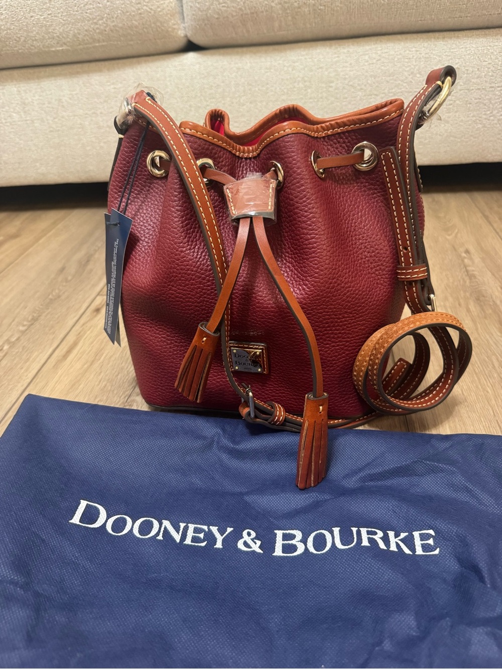 Dooney & Bourke Wine Red Pebble Leather Drawstring Crossbody with Tan Trim